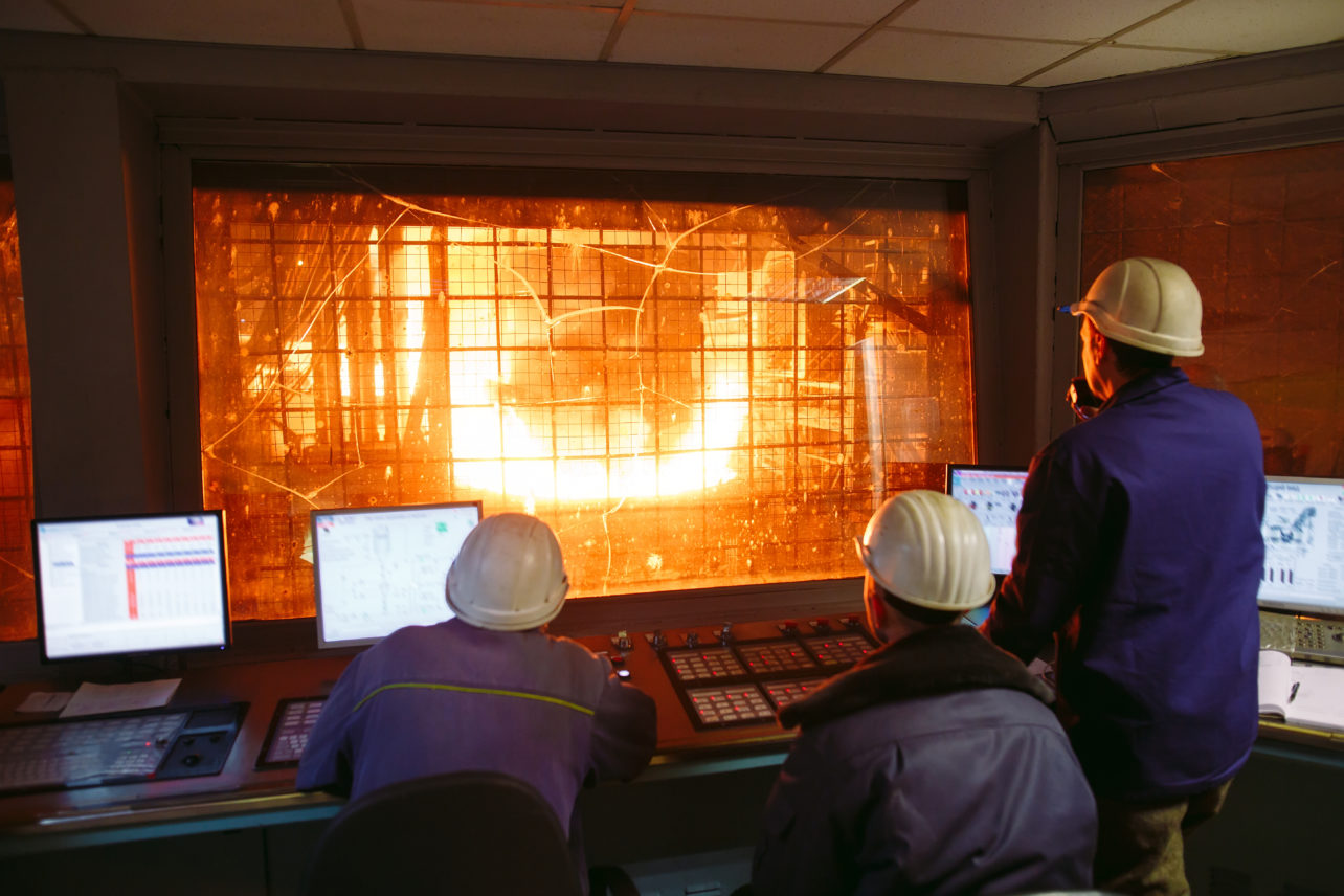 Steel production workers in control room