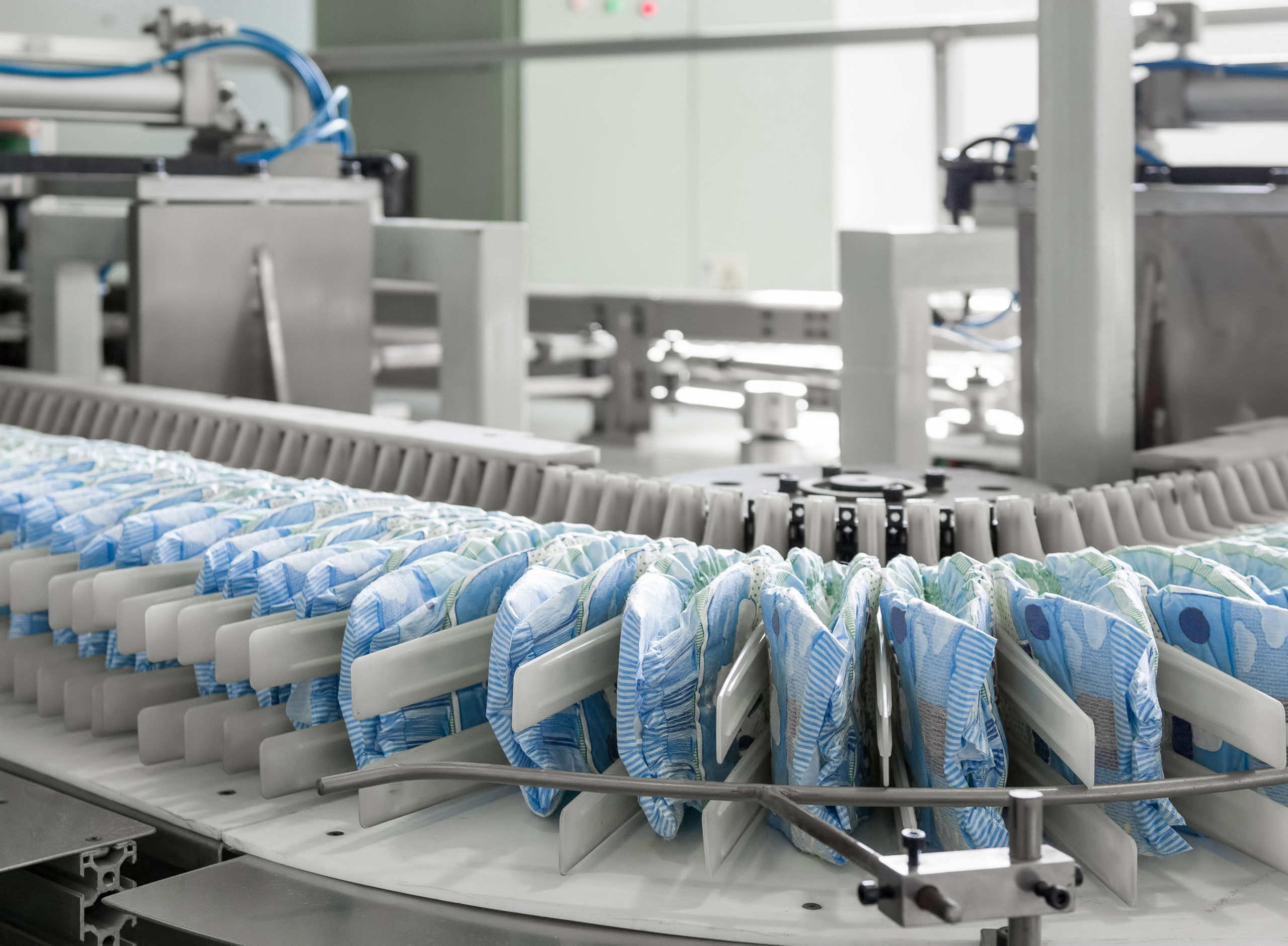 Diapers on manufacturing production equipment