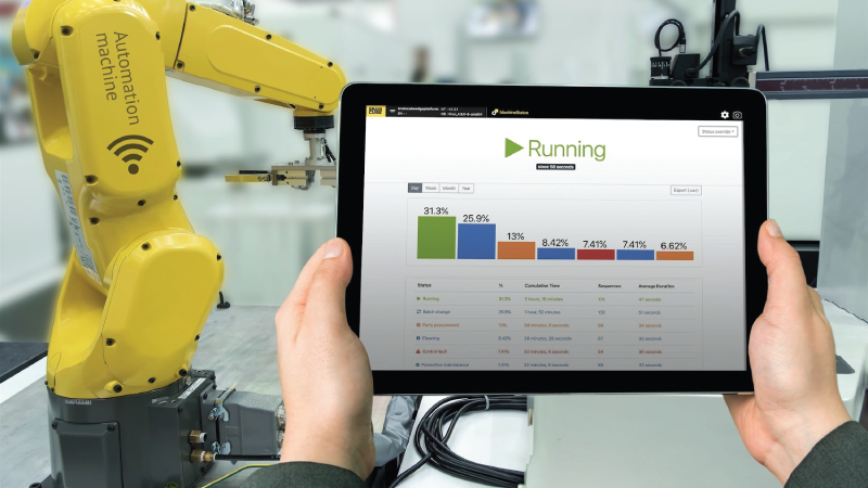 Screenshot of Braincube's Machine Status App, an Edge analytics app designed for manufacturing, with machine in the background