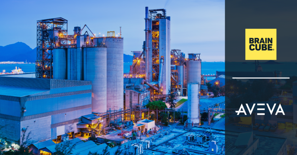 Large industrial manufacturing facility operating at dusk, illustrating connected operations supported by AVEVA and Braincube.